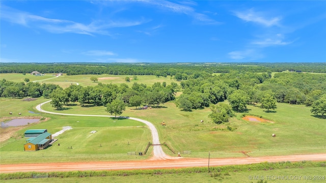 birds eye view of property with a rural view