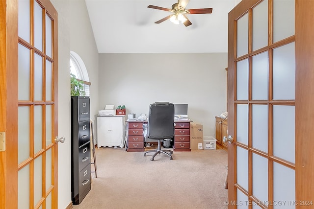 carpeted office space with vaulted ceiling, ceiling fan, and french doors