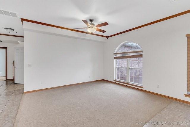 empty room featuring ornamental molding, light carpet, and ceiling fan