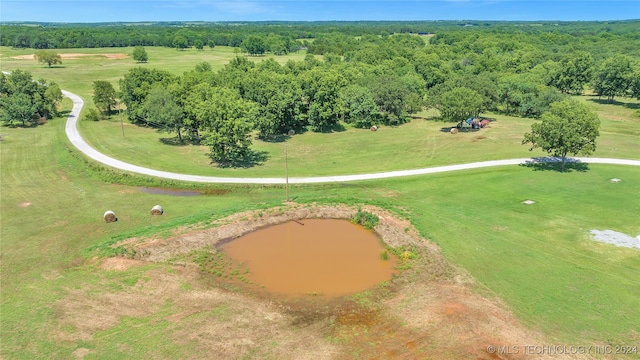 aerial view with a rural view and a water view