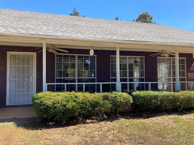 doorway to property featuring ceiling fan