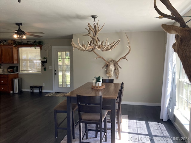 dining room featuring dark wood-type flooring and ceiling fan