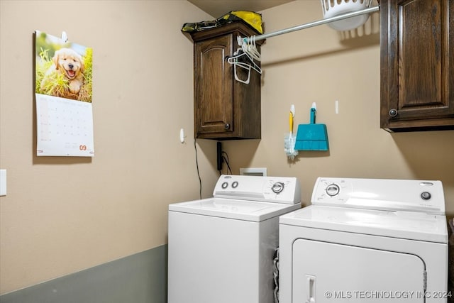 laundry area with cabinets and separate washer and dryer