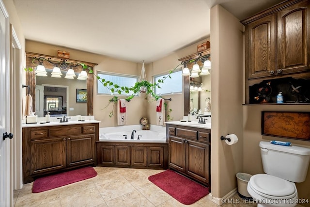 bathroom featuring vanity, tile patterned flooring, a tub, and toilet