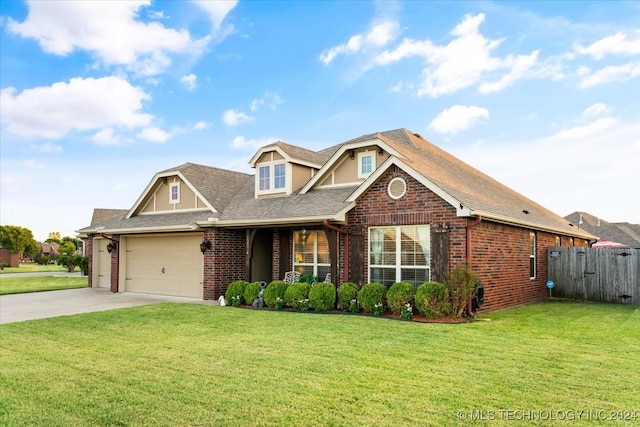 view of front of house with a front yard and a garage