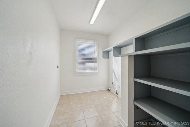 walk in closet featuring light tile patterned floors