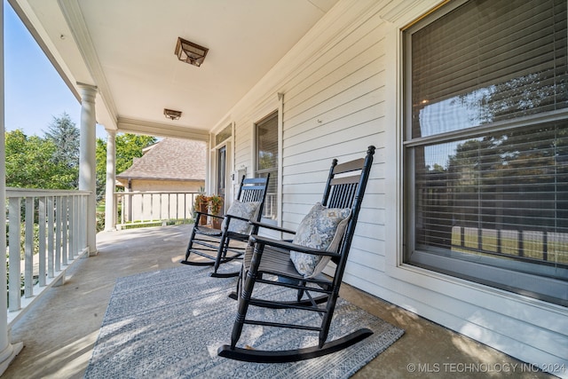 view of patio featuring a porch