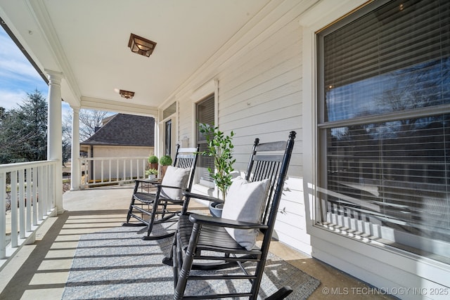 balcony featuring a porch