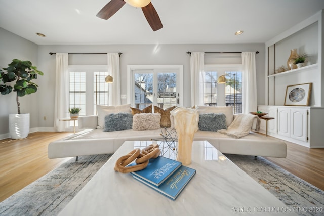 living room with recessed lighting, baseboards, wood finished floors, and ceiling fan