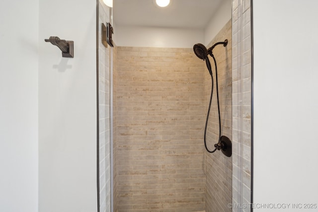 details featuring a tile shower