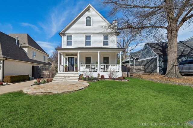 view of front of house featuring a porch and a front lawn