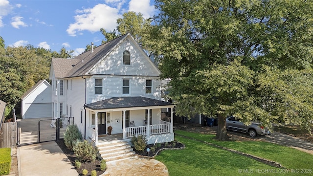 view of front of house featuring a front lawn and covered porch