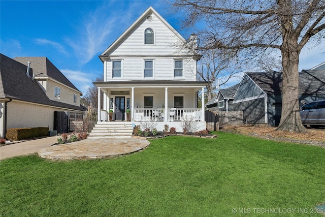 view of front of house with a porch and a front yard