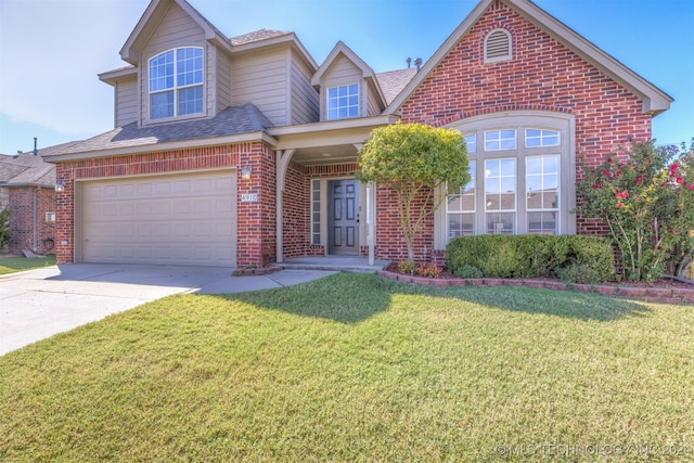 view of front of property with a garage and a front lawn