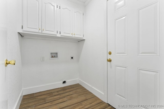 washroom with washer hookup, dark hardwood / wood-style floors, electric dryer hookup, and cabinets