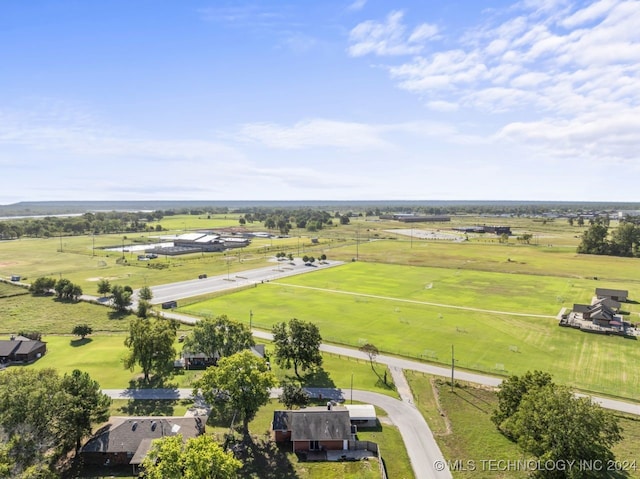 birds eye view of property with a rural view