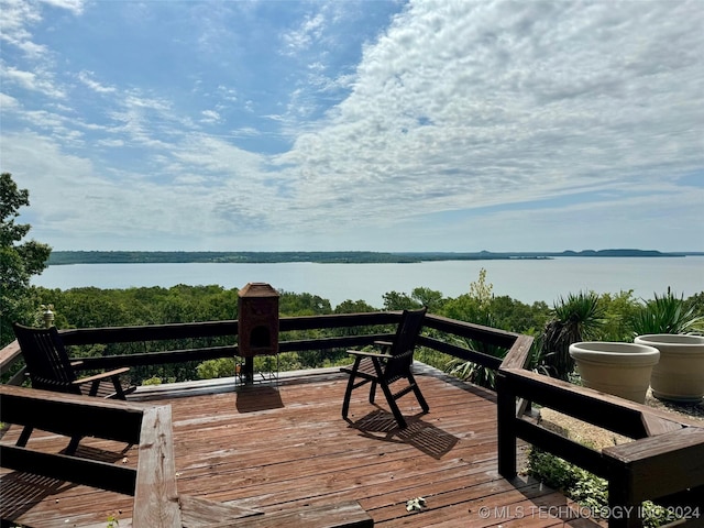 wooden terrace with a water view