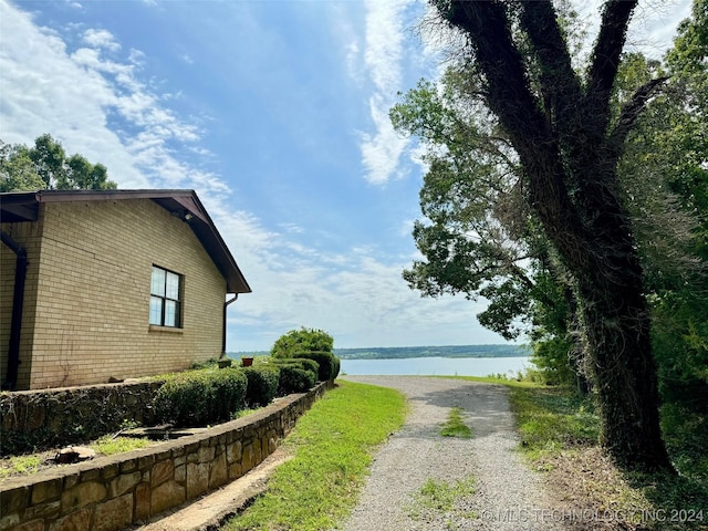 exterior space with a water view