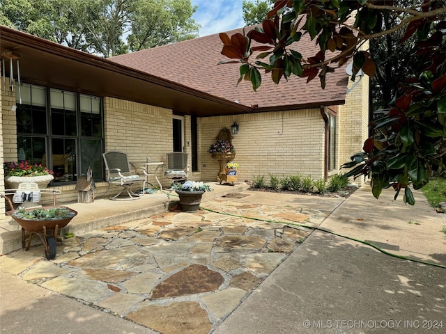 rear view of house featuring a patio