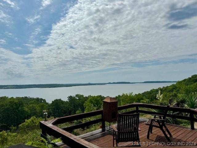 wooden deck with a water view