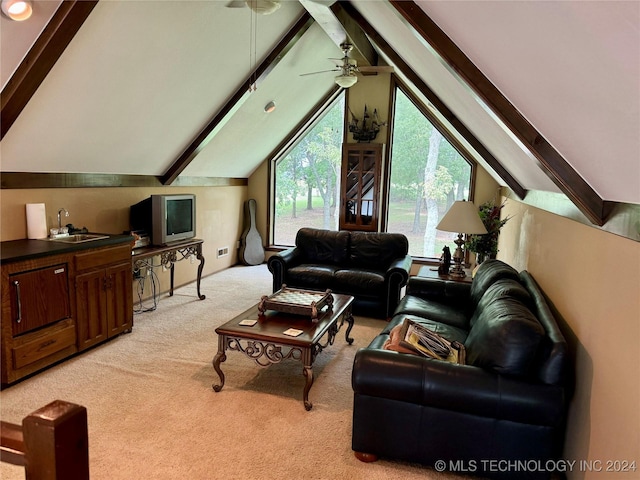 living room featuring sink, light colored carpet, and vaulted ceiling with beams