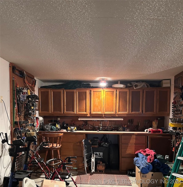 interior space featuring a textured ceiling