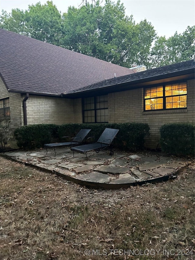 rear view of house featuring a patio area