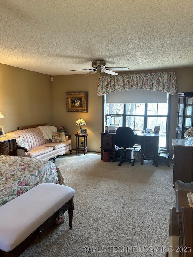 living room with ceiling fan, a textured ceiling, and carpet flooring