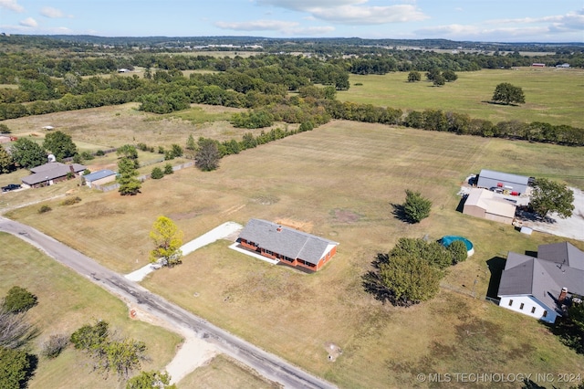 birds eye view of property with a rural view