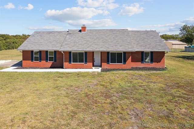18440 County Road 3564, Ada, OK 74820 - ranch-style house with brick siding, a front yard, a chimney, and roof with shingles