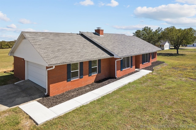 18440 County Road 3564, Ada, OK 74820 - view of property exterior with brick siding, an attached garage, a shingled roof, a chimney, and a lawn