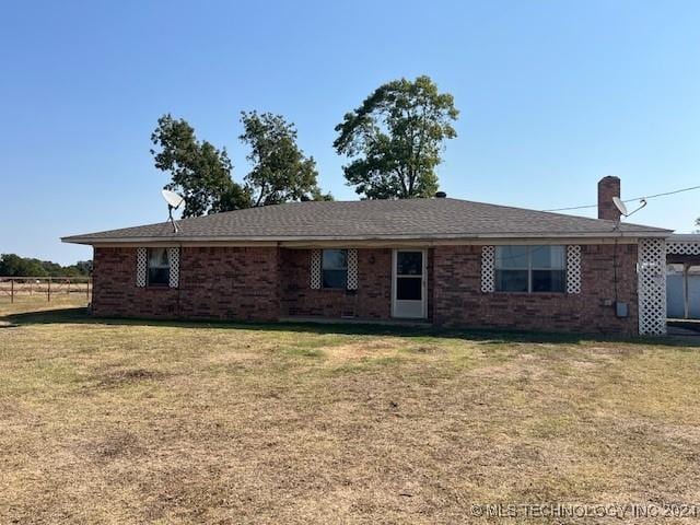 1384 Academy Rd, Bennington, OK 74723 - single story home with brick siding and a carport