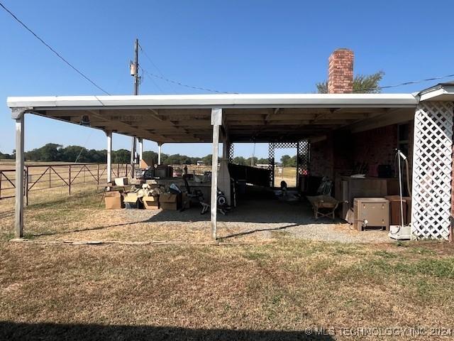 1384 Academy Rd, Bennington, OK 74723 - view of vehicle parking featuring fence
