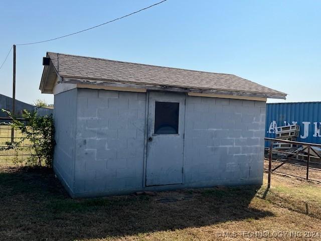 1384 Academy Rd, Bennington, OK 74723 - view of outbuilding with fence and an outdoor structure