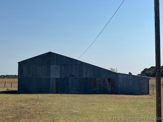 1384 Academy Rd, Bennington, OK 74723 - view of pole building with a yard