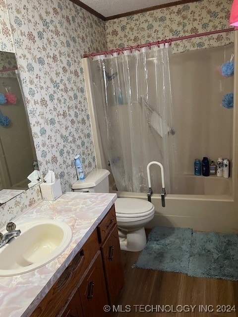 full bathroom featuring hardwood / wood-style flooring, toilet, shower / bath combination with curtain, vanity, and a textured ceiling