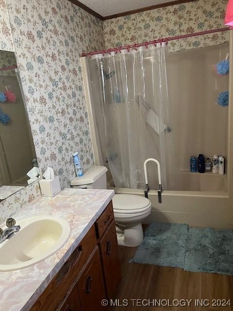 1384 Academy Rd, Bennington, OK 74723 - full bath with wallpapered walls, crown molding, toilet, vanity, and wood finished floors