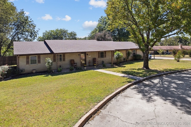 single story home with brick siding, driveway, a shingled roof, and covered porch
