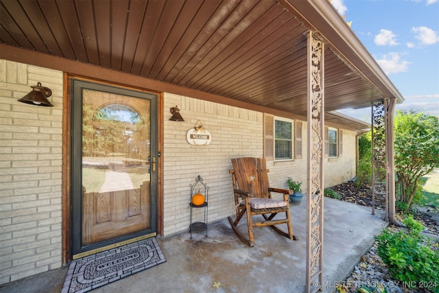 entrance to property with brick siding