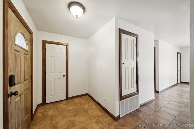 entrance foyer featuring baseboards