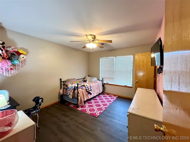 bedroom with ceiling fan and dark wood-type flooring