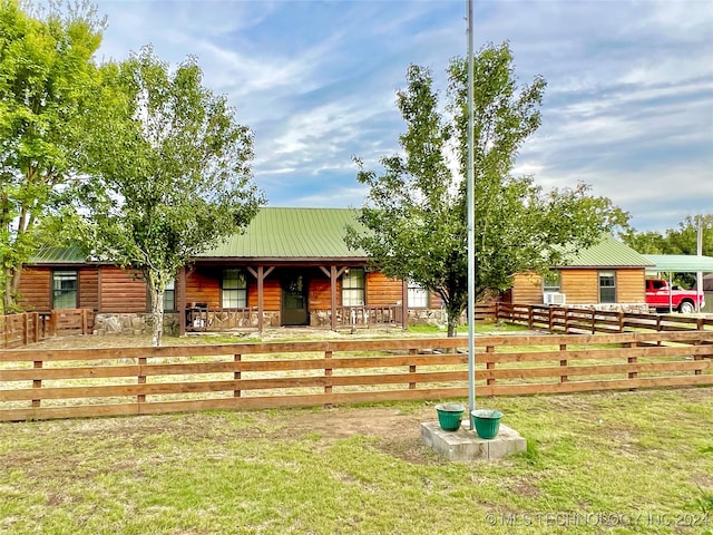 log-style house with a front lawn