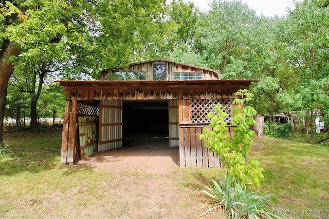 view of outdoor structure with a lawn