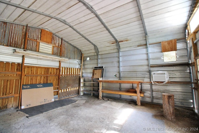 garage with a wall mounted air conditioner