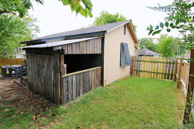 view of outdoor structure with a lawn