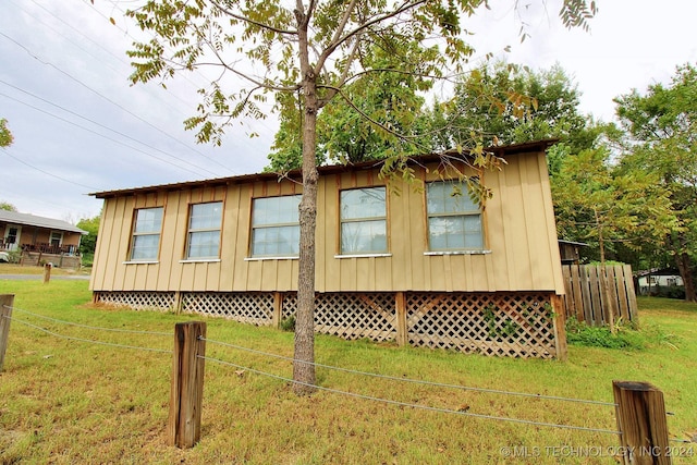 view of home's exterior featuring a lawn