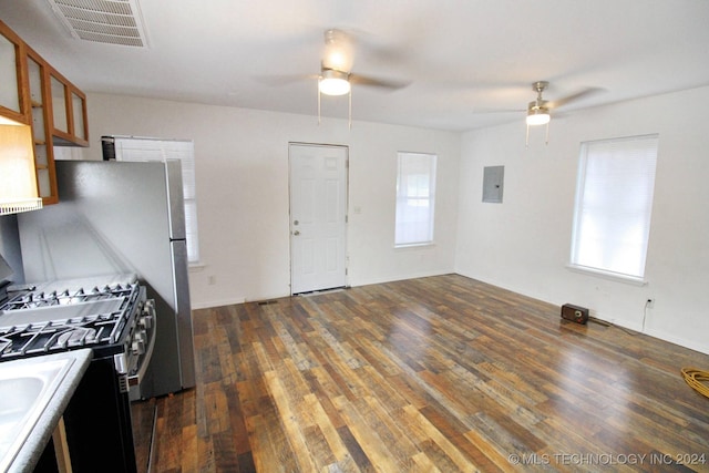 kitchen with electric panel, ceiling fan, dark wood-type flooring, and stainless steel gas range