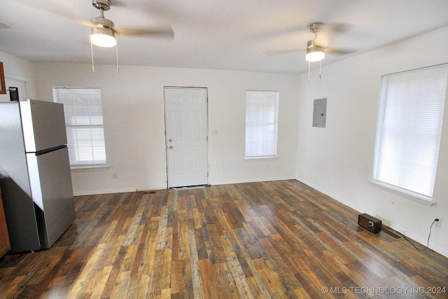 516 W Fox St, Tahlequah, OK 74464 - unfurnished living room with a ceiling fan, electric panel, and wood finished floors