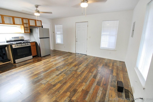 516 W Fox St, Tahlequah, OK 74464 - kitchen with stainless steel gas range, a ceiling fan, freestanding refrigerator, and wood finished floors
