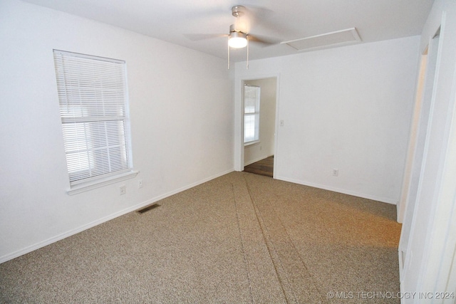 516 W Fox St, Tahlequah, OK 74464 - spare room featuring carpet, ceiling fan, and attic access